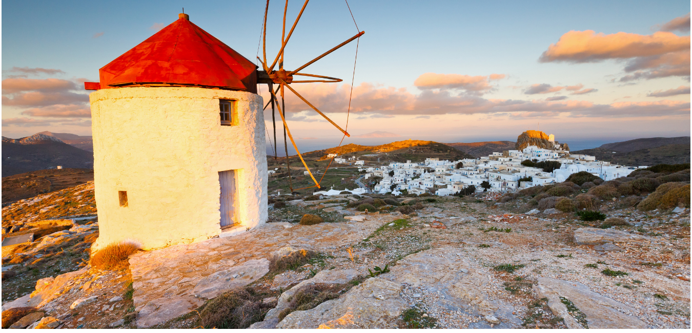 a white and red stone windmill on Amorgos