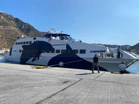 A Greek ferry docked at pier