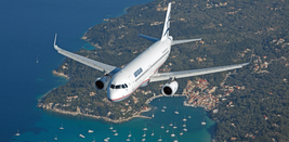 An Aegean Airlines plane flying over an island
