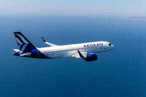 An aegean airlines plane flies over an island
