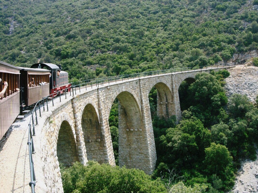 The Pelion Train crossing over a bridge on its way up to Milies